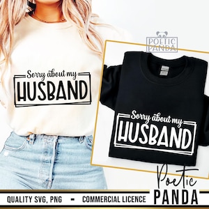 May include: Two sweatshirts, one cream and one black, each with the text "Sorry about my HUSBAND" in a white, framed font. The cream sweatshirt is on a person, and the black one is displayed on a white background.