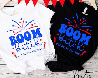 May include: Two black and white t-shirts with a red, white, and blue firework design and the text "BOOM bitch GET OUTTA THE WAY".