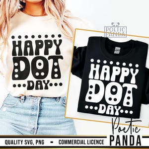 May include: Two t-shirts, one cream and one black, each displaying the words "HAPPY DOT DAY" in a bold, retro font. The design includes dot accents above and below the text. The cream shirt is being worn, while the black shirt is displayed on a white background.