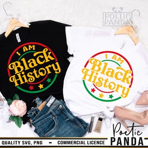 May include: Two black and white t-shirts with a colorful circle design that says "I Am Black History".