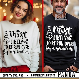 May include: Two sweatshirts, one white and one black, each with the text "Most Likely To Be Run Over by a Reindeer." The design includes a Christmas tree, Santa hat, and holly. The white sweatshirt is worn by a person with a red hat.