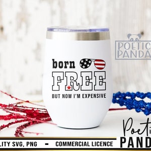 May include: White stainless steel wine tumbler with a red, white, and blue American flag design. The tumbler has the text "born FREE BUT NOW I'M EXPENSIVE" printed on it.