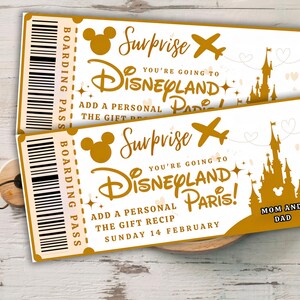 May include: Two golden Disneyland Paris boarding passes with the text "Surprise! You're going to Disneyland Paris!" and "Mom and Dad". The tickets feature a Mickey Mouse silhouette, an airplane, and a castle.