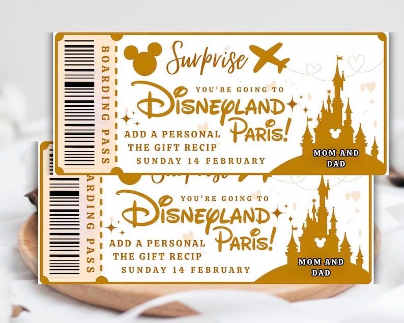 May include: Two gold-colored Disneyland Paris boarding passes. The tickets feature the Disneyland logo, a castle silhouette, and the text "Surprise, You're Going to Disneyland Paris!" with "Mom and Dad" at the bottom. The date is Sunday, February 14.