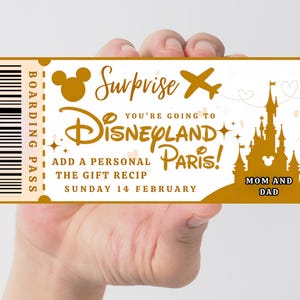 May include: A gold-colored Disneyland Paris boarding pass with the text "Surprise, You're Going to Disneyland Paris!" and "Mom and Dad." The pass includes a Mickey Mouse silhouette, an airplane, and a castle illustration.