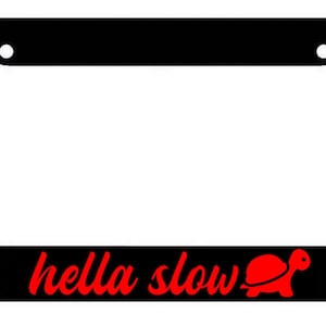 May include: Black license plate frame with a red "hella slow" text and a red turtle graphic.