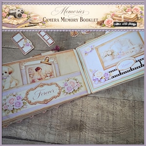 May include: Open scrapbook with floral and vintage design elements. The cover reads "Memories Camera Memory Booklet." Inside, pages feature framed images, decorative borders, and the word "Forever." Accompanying film strip-shaped embellishments and a puppy illustration.