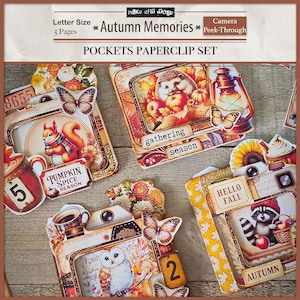 May include: A collection of autumn-themed paperclip sets. Each paperclip features a camera design with fall imagery, including a squirrel, owl, hedgehog, and raccoon. The text includes "Autumn Memories," "Pumpkin Spice Season," and "Hello Fall."