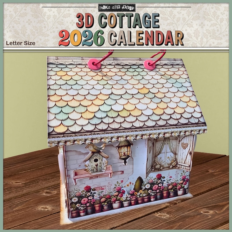 May include: A 3D cottage calendar for 2026. The calendar is shaped like a house with a detailed roof, a birdhouse, and flower pots. The text "3D Cottage 2026 Calendar" is displayed at the top. The calendar is letter size.