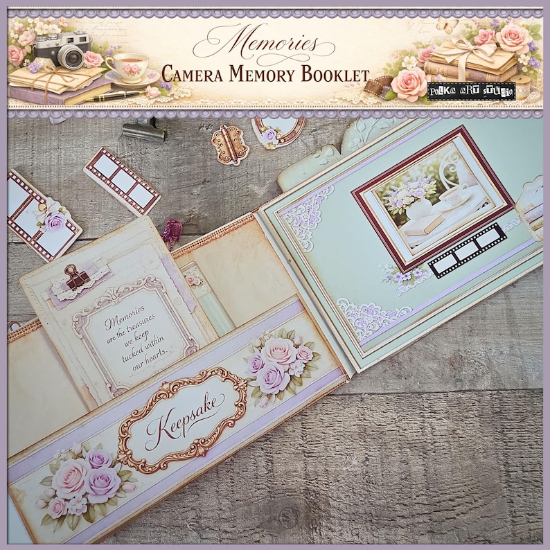 May include: An open scrapbook with a vintage aesthetic. The cover reads "Memories CAMERA MEMORY BOOKLET." Inside, a framed picture, film strip accents, and floral embellishments are visible. The word "Keepsake" is displayed on a decorative banner, and the text "Memories are the treasures we keep tucked within our hearts" is also visible.