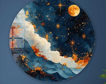 May include: A round wall art piece with a celestial design. The artwork features a dark blue background with a moon, stars, and clouds in shades of white, orange, and gold. The art is mounted on a dark blue wall above a wooden cabinet.