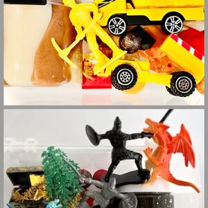 May include: A sensory kit containing two clear containers filled with brown and black glittery slime, accompanied by plastic construction toys including a yellow dump truck, a yellow worker figure, a shovel, and fantasy figures like a dragon and knight.