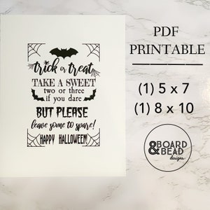 May include: Printable Halloween sign with a black bat and spiderweb design. The sign reads "trick or treat take a sweet two or three if you dare but please leave some to spare! Happy Halloween!" The sign is available in two sizes: 5x7 inches and 8x10 inches.