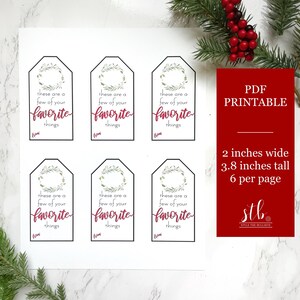 May include: Printable gift tags with a wreath design and the text "These are a few of your favorite things". The tags are 2 inches wide and 3.8 inches tall, with 6 per page.