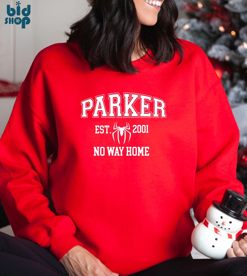 May include: Red sweatshirt with white text that reads "Parker Est. 2001 No Way Home" with a white spider graphic.