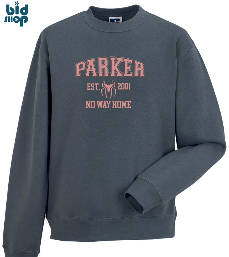 May include: A dark blue sweatshirt with a pink graphic print that says "Parker Est. 2001 No Way Home" with a spider graphic.
