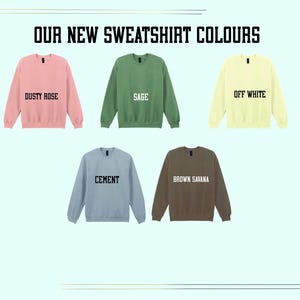 five different colored sweatshirts, each with a unique color and label, indicating the new colors for the sweatshirt collection.