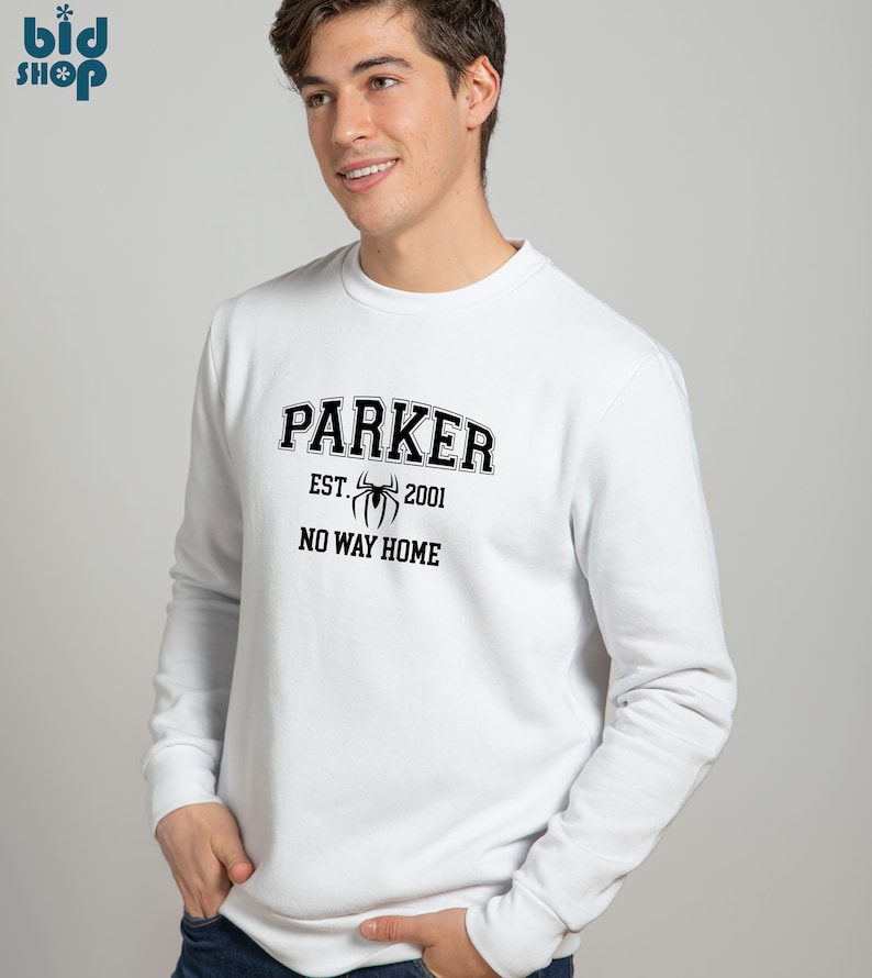 May include: White sweatshirt with a black graphic print of a spider and the text "Parker Est. 2001 No Way Home".
