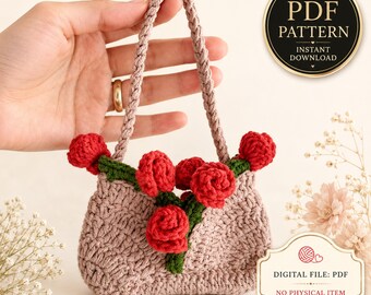 May include: A crochet pattern for a small handbag featuring a light brown textured body with a braided handle and decorative red crocheted roses with green stems. The image includes text stating PDF PATTERN INSTANT DOWNLOAD and DIGITAL FILE: PDF.