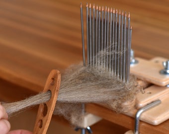 Wool combs with holder, diz and leather covers.