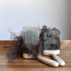 Wool combs 2 rows with leather covers and wooden diz.