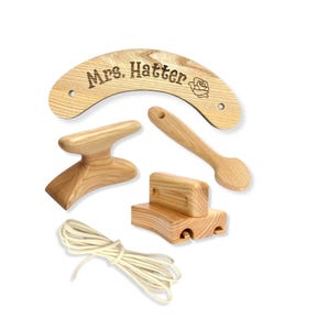 Hat maker tool set. Foot tolliker, pusher downer, puller downer, brim curler.