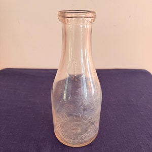 Embossed Quart Milk Bottle Manchester, NH Geo. Ingle Dairy Glass