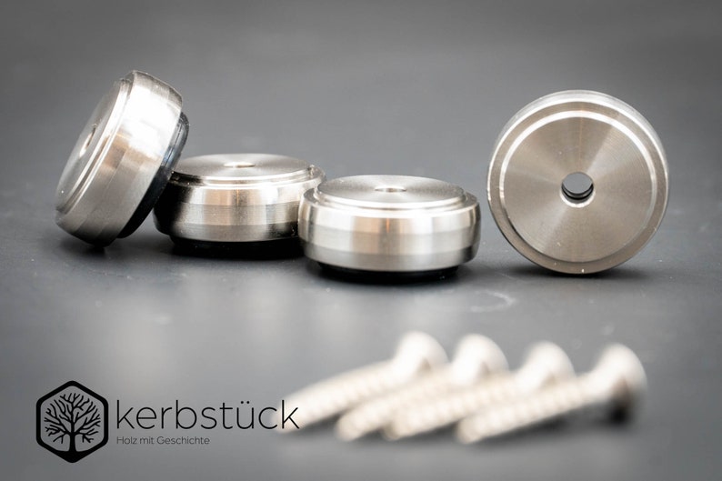 May include: Four silver metal furniture feet with a black rubber base and four silver screws. The furniture feet are designed to protect floors from scratches.