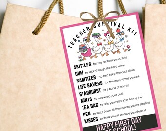 May include: A gift tag with a pink border and the words "Teacher Survival Kit" and "Happy First Day of School!" The tag features cartoon ducks and a list of items like Skittles, gum, sanitizer, and tea bags.