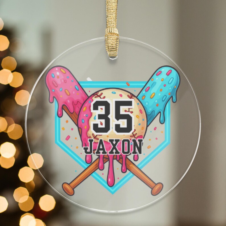 May include: A clear, round ornament with a baseball theme. The design features crossed baseball bats, a baseball-shaped element with the number 35, and the name "Jaxon." The baseball elements have a colorful, melted ice cream design with pink, blue, and sprinkles.