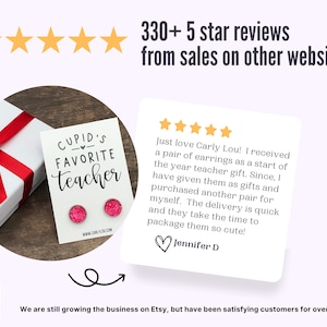 May include: Pink glitter earrings with the text "Cupid's Favorite Teacher" on a white card. The earrings are packaged in a white gift box with a red ribbon. The image also includes a customer review with five stars and a testimonial.