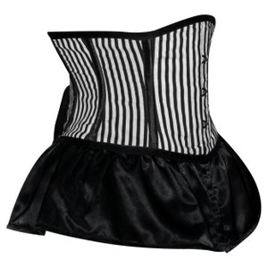 May include: A black and white striped corset with a black satin ruffle at the bottom.