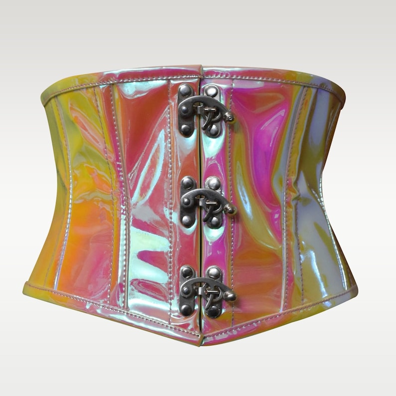 May include: A shiny iridescent pink and yellow corset with silver buckles and a front closure.