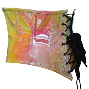 May include: A shiny iridescent pink and yellow corset with black lacing and a bow on the side.