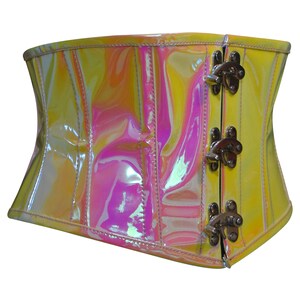 May include: A yellow iridescent corset with a shiny finish and metal clasps. The corset has a smooth, glossy surface and is designed to cinch the waist.