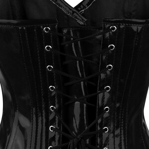 May include: Black patent leather corset with a lace-up back. The corset has a shiny finish and is designed to cinch the waist.