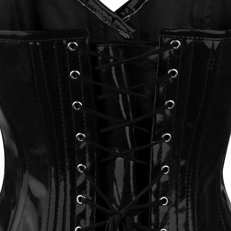 May include: Black patent leather corset with a lace-up back. The corset has a shiny finish and is designed to cinch the waist.