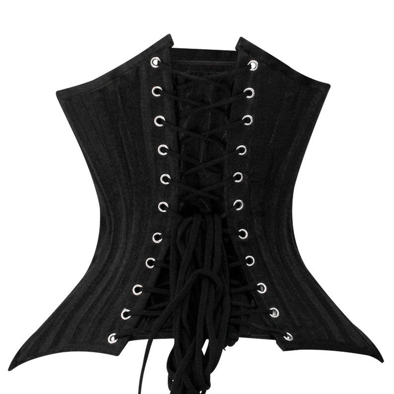 May include: Black corset with a lace-up back and metal eyelets. The corset is made of a ribbed fabric and has a pointed shape at the bottom.