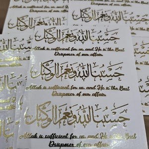 May include: A white background with gold Arabic calligraphy that reads "Allah is sufficient for us, and He is the Best Disposer of our affairs." The text is repeated multiple times on the page.