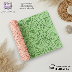 May include: A rolled-up, peach-colored 3D-printed rolling pin with a detailed pattern, next to a green textured sheet. The rolling pin is 0.79 inches in diameter and 3.94 inches long. The image includes text: "CutterCoutureFiles" and "INSTANT DOWNLOAD DIGITAL FILE".