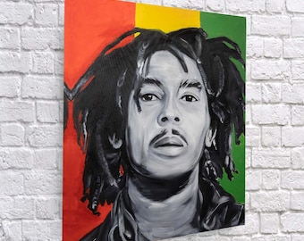 May include: A black and white portrait painting of Bob Marley with a red, yellow, and green background. The painting is on a canvas.