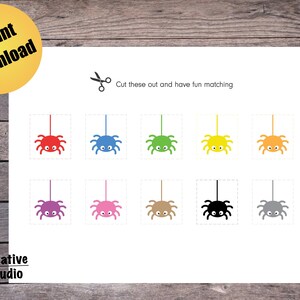 May include: Printable Halloween spider matching game. Cut out the spiders and match the colors. There are eight spiders in total, each with a different color: red, blue, purple, pink, brown, black, gray, and yellow.