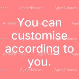 May include: A coral-colored background with the white text "You can customise according to you." The text is in a sans-serif font. The words "AgateNstones" are repeated in a smaller font around the edges of the image.