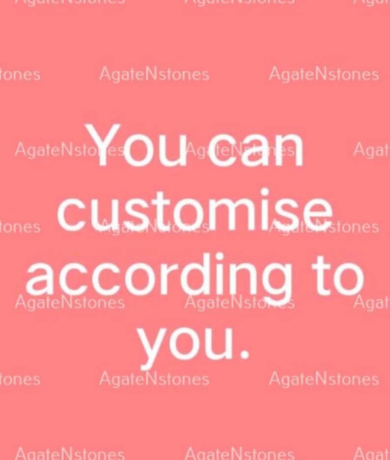 May include: A coral-colored background with the white text "You can customise according to you." The text is in a sans-serif font. The words "AgateNstones" are repeated in a smaller font around the edges of the image.