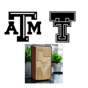 May include: Image features two black and white logos: one with the letters "A", "T", and "M" stacked, and another with a stylized "T". Below, a book with pages carved to display the shape of Texas, with a brown cover.