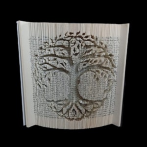 May include: A white book with pages folded into a three-dimensional tree design. The tree is made of paper and has a detailed, intricate design.