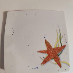 Hand painted porcelain plate . Starfish