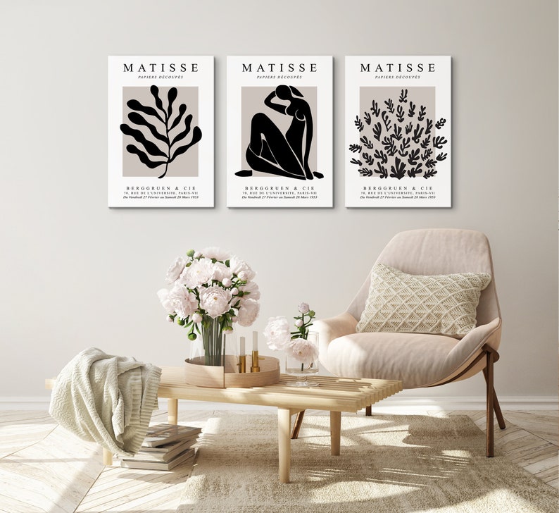 May include: Three black and white Matisse prints with the title "PAPIERS DECOUPES" and the artist's name "MATISSE" in white text. The prints feature a stylized leaf, a woman's figure, and a cluster of leaves.