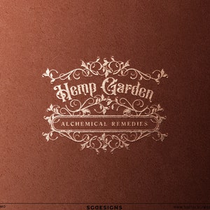 Elegant vintage botanical logo displayed as luxury branding mockup. Ornate apothecary style emblem with herbal flourishes and classic typography designed for candle brands, herbal remedy businesses, botanical skincare brands, witchy wellness brands, and handcrafted product businesses.