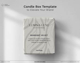 May include: A white candle box with a black and gray abstract design. The text on the box reads "Lumina Luxe" and "Midnight Velvet". The candle is a 7 oz / 250g soy candle with a scent of black amber, dark vanilla bean, and velvety musk.